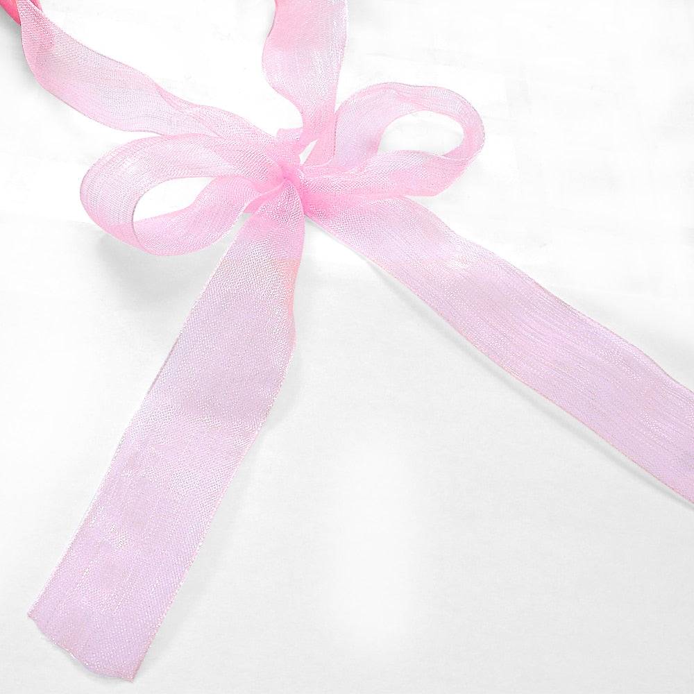 closeup pink bow ribbon white background