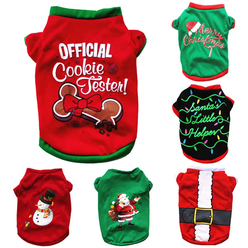 six christmas dog shirts laid out white background