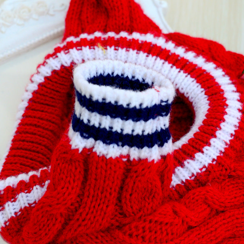 closeup red sweater knitted material white blue sleeve