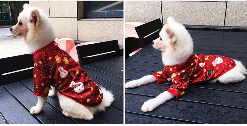 small white dog laying down snowman red shirt