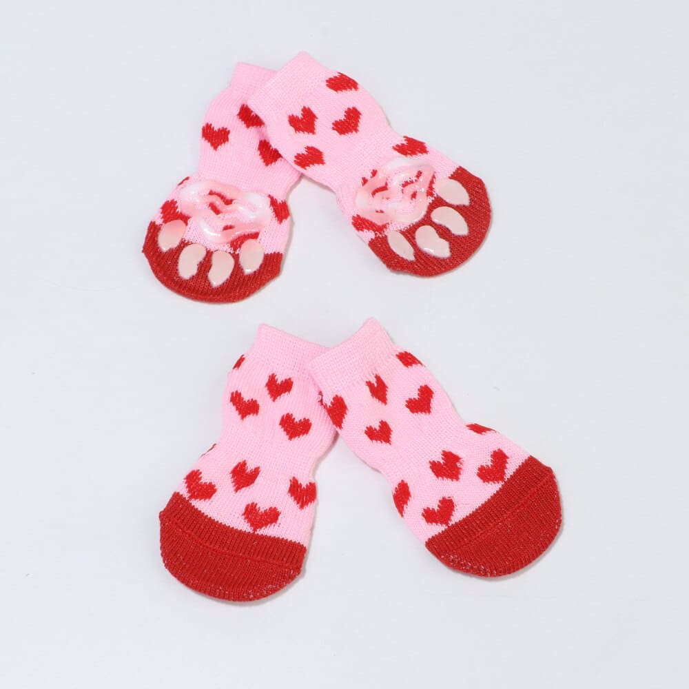 heart patterned pink dog socks white background