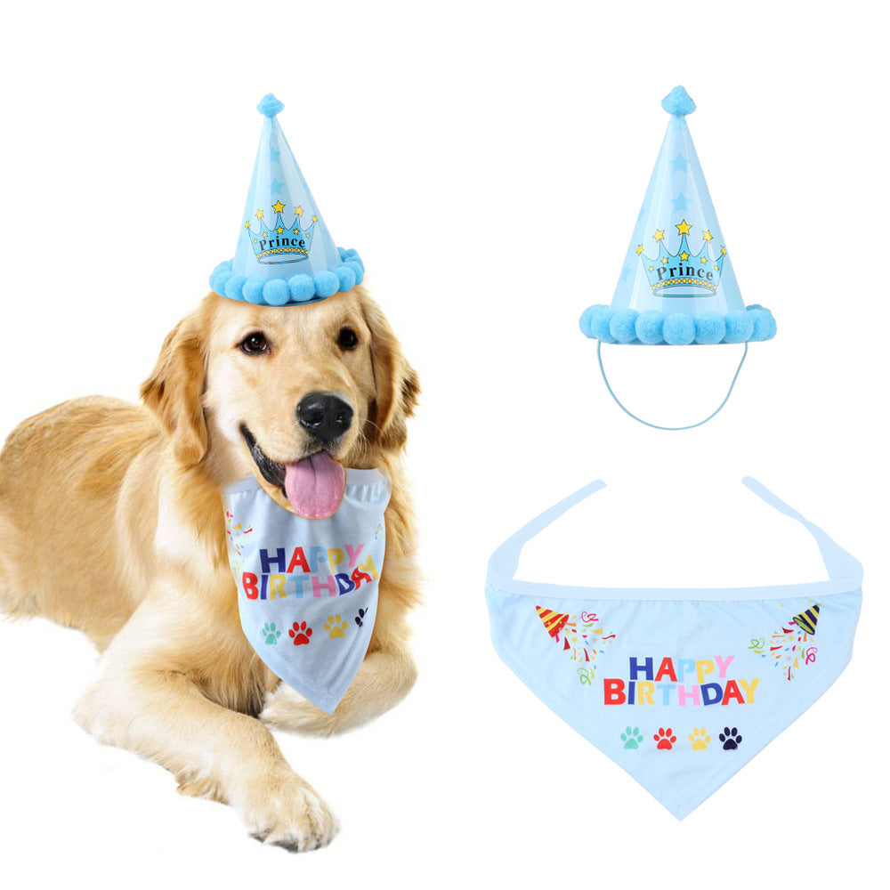 golden retriever laying with blue birthday hat and bandanna white background