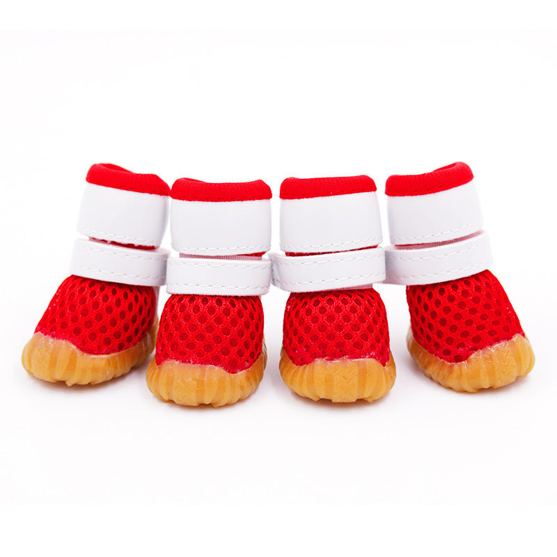 red mesh dog boot with white straps and white background