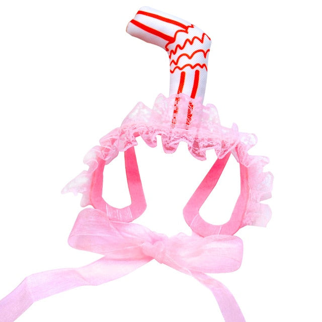 pink dog hat with milkshake straw white background