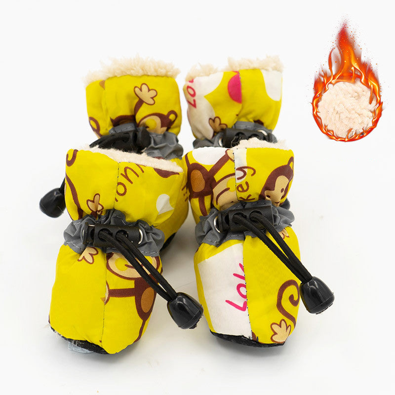 yellow winter dog boots with monkey print and draw strings